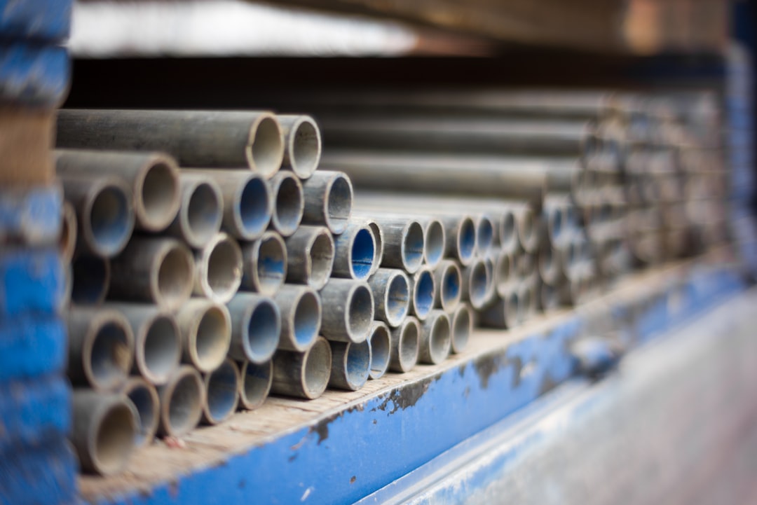 Cut lengths of pipe stacked and bundled on a rack
