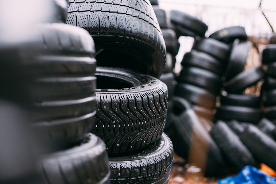 Stacks of moulded rubber tyres in a factory yard